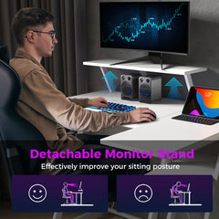 A person using the L-shaped computer desk with a monitor stand for better posture
