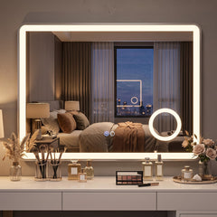 The illuminated bathroom mirror with anti-fog and 3x magnification in a bedroom dressing area