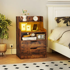 Rustic brown bedside table with open shelf and drawers, set up next to a bed with accessories