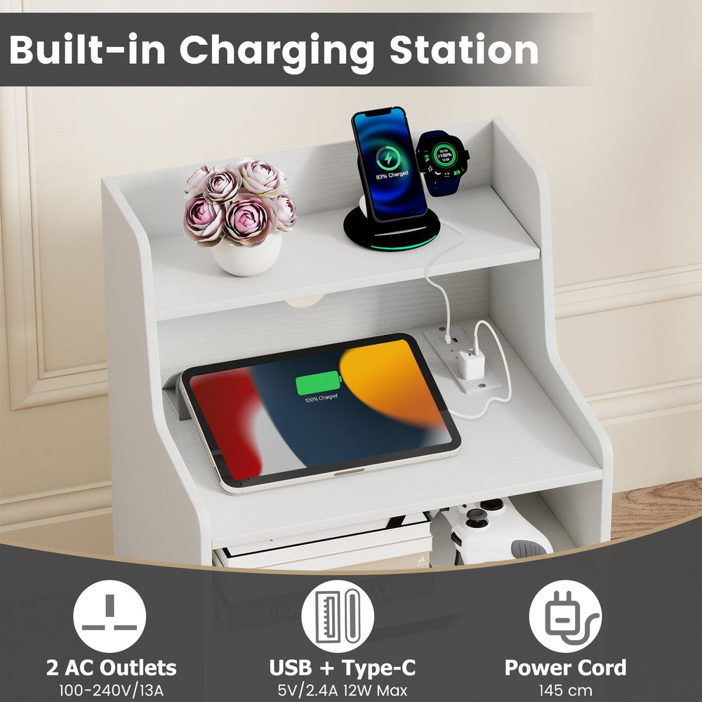 The bedside tables featuring a close up of the charging station with plugs and USB ports