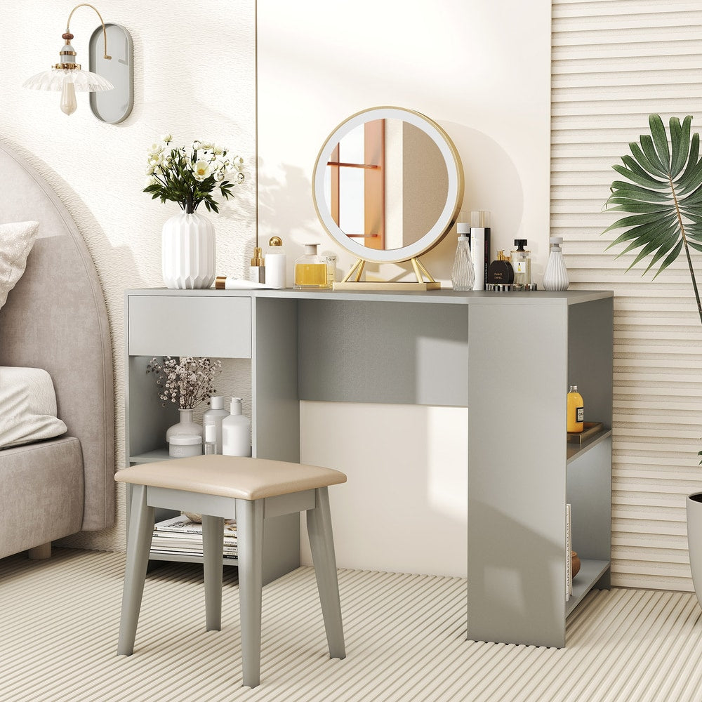 Grey L-shaped desk used as a dressing table with a stool and mirror