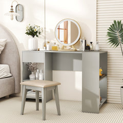 Grey L-shaped desk used as a dressing table with a stool and mirror