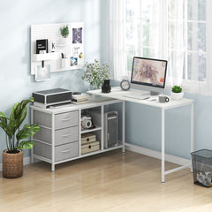 The office desk set up in a bright room with a computer and printer on the white surfaces