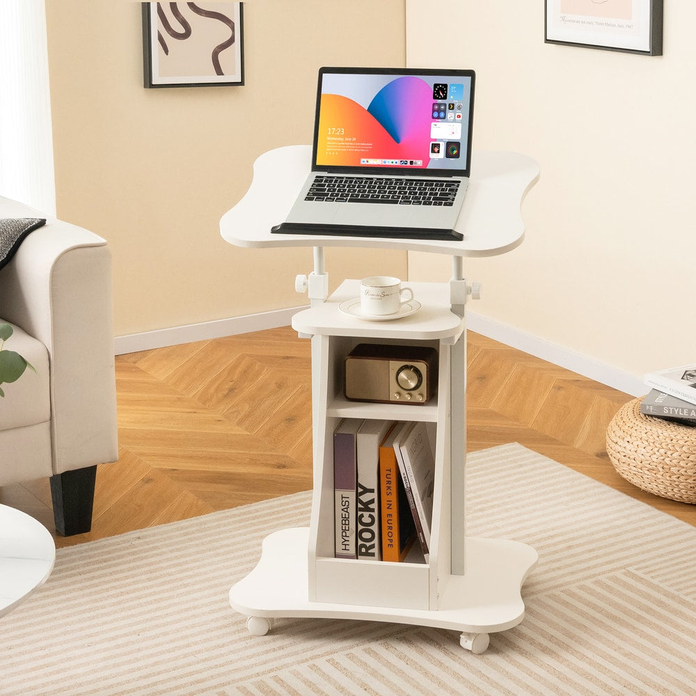 The white laptop table with wheels is shown in a bright room with a sofa and a rug