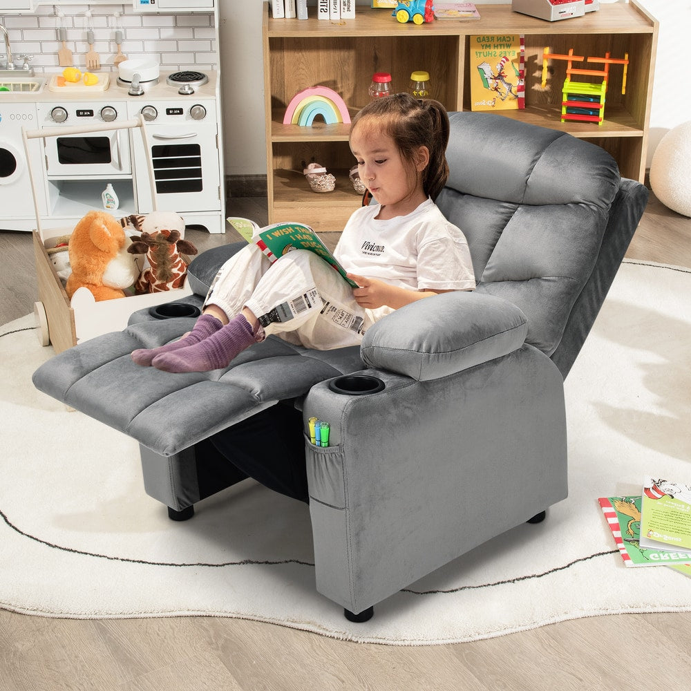 The kids recliner chair in use by a child reading a book in a playroom