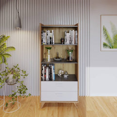 The bookcase filled with books and decorative items in a room setting