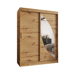 The oak effect sliding door wardrobe with a curved mirror on a white background