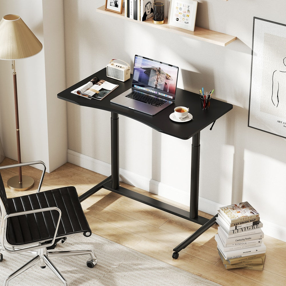 The office desk set up as a workspace with a chair and laptop in a bright home office