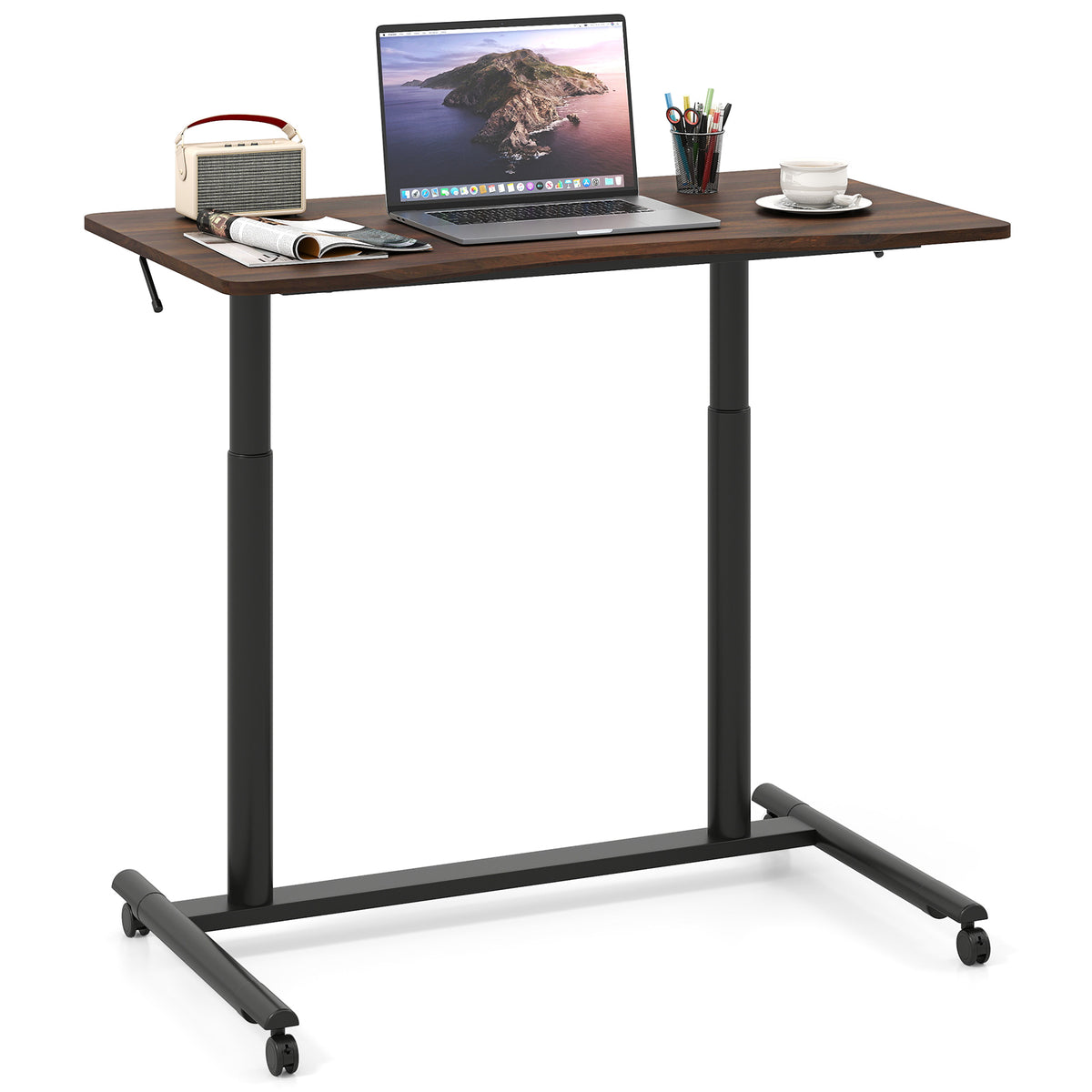 The brown C-shaped desk with a laptop, radio and coffee cup