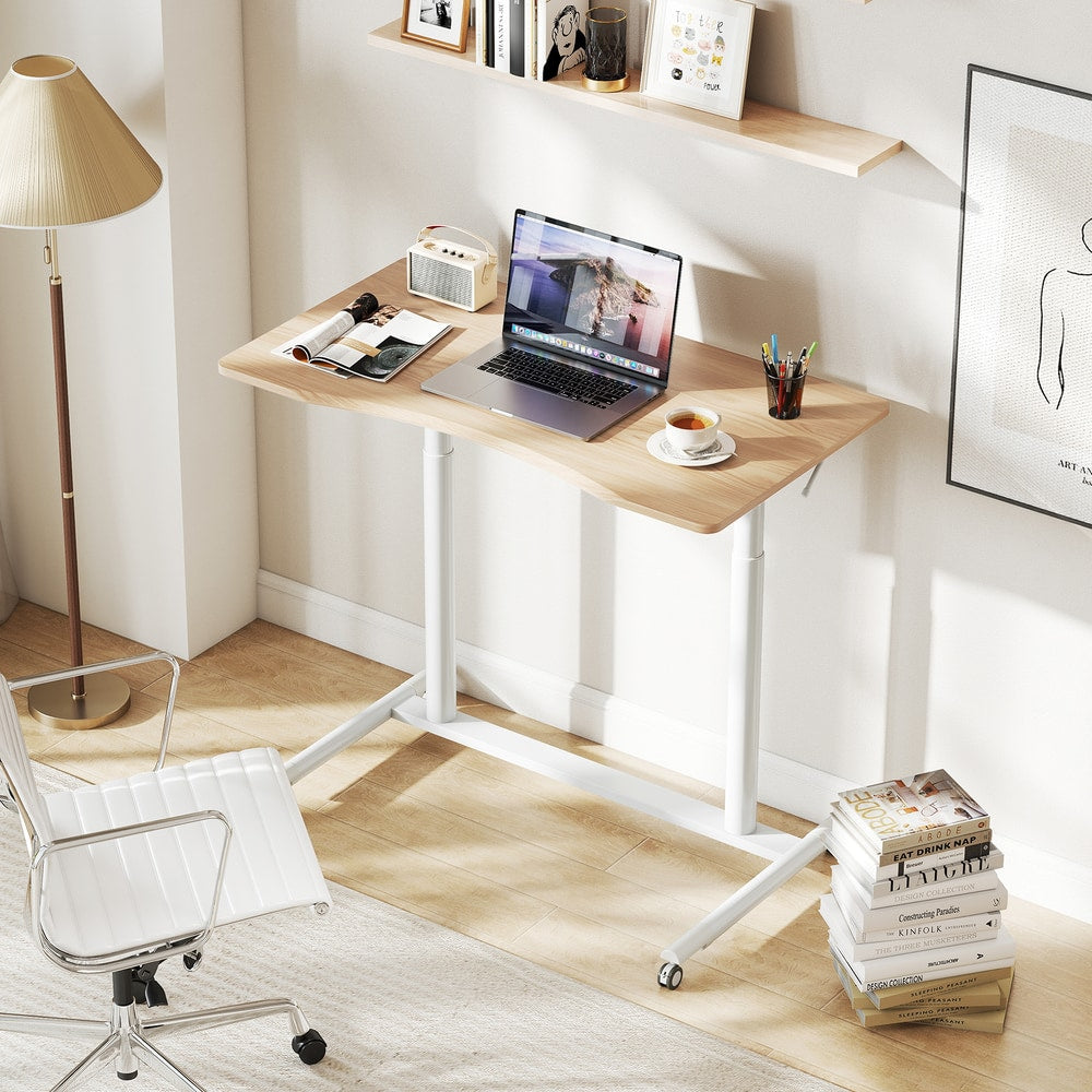 The C-shaped desk in a home office setting with a chair and books