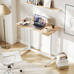 The C-shaped desk in a home office setting with a chair and books