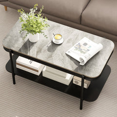 Coffee table with grey marble effect top, a cup of tea and magazines on top, in a lounge