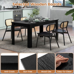 Close up of the black dining table surface showing wood grain texture