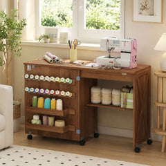 The sewing table in a room with a sewing machine and various craft supplies