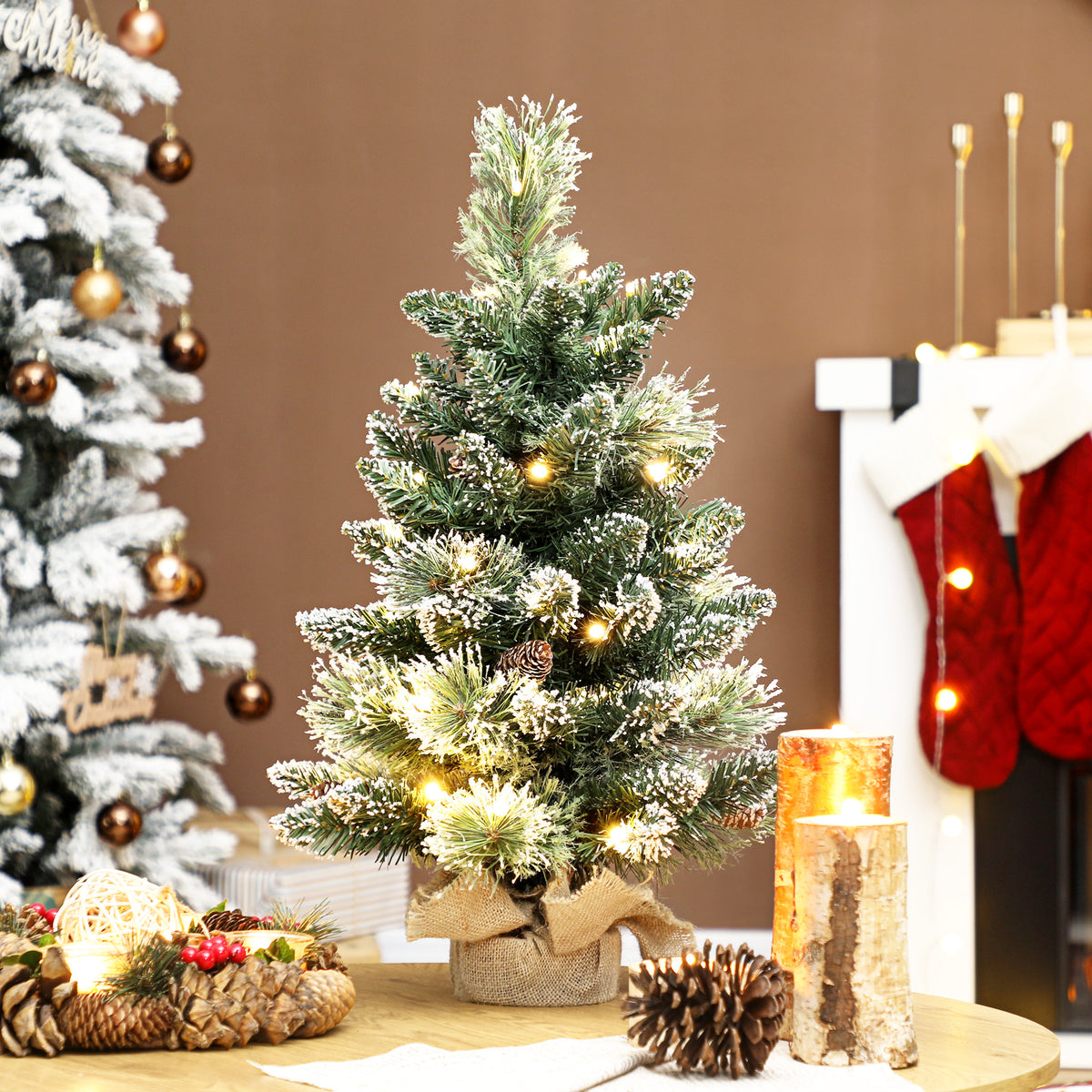 HOMCOM 60 cm Prelit Small Christmas Tree, Snow Flocked Tabletop Mini Xmas Tree with 35 LED Lights, Pine Cones and Linen Cover Base, Battery Operated, Green