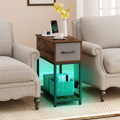 The side table in a living room between two armchairs