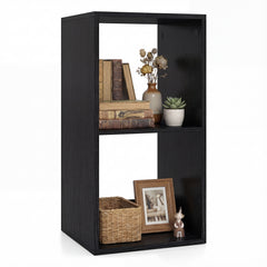 The black two-tier bookcase styled with books, a plant and decorative items