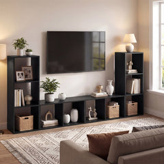 The black two-tier bookcase as part of a media unit with a television and sofa