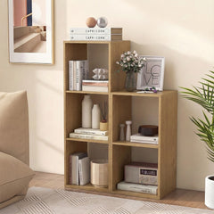 The natural wood open back 2-tier bookshelf filled with books and decorative items