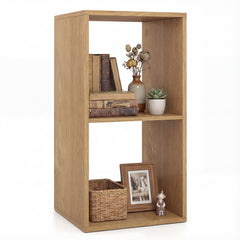The natural wood open back 2-tier bookshelf with books, a basket and a photo frame