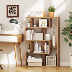 The open-back geometric bookcase in a home office with a desk and lamp