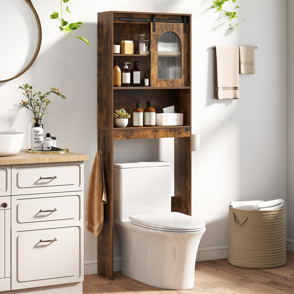 The over the toilet storage placed in a bright bathroom with toiletries and towels on shelves