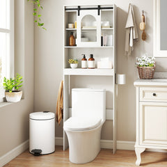 The cabinet placed over a toilet with various bathroom accessories displayed on the open shelves