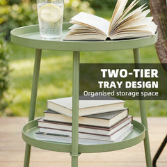 The two-tier round coffee end table with books and a drink on its shelves