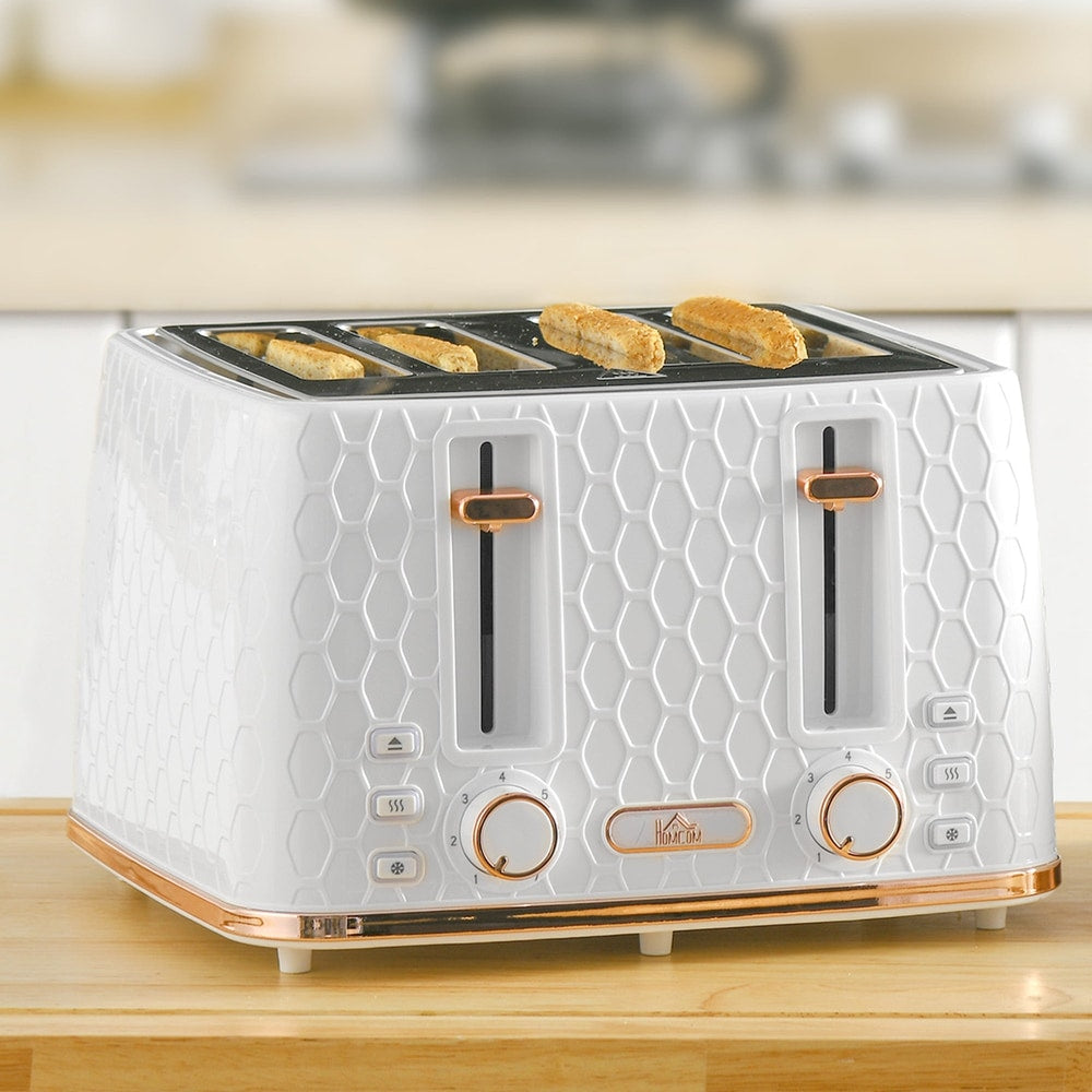 Four slices of toast cooking in the white honeycomb toaster on a wooden counter