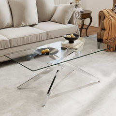 The coffee table styled with black bowls and books in a modern lounge setting