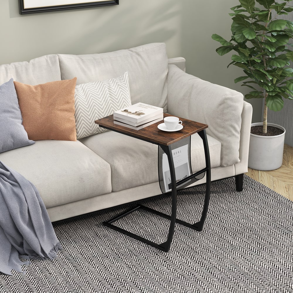 C-shaped sofa side snack table next to a sofa with a book on top