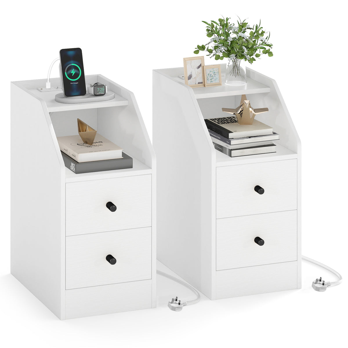 The white end tables styled with books, plants and a phone charging on the top surface