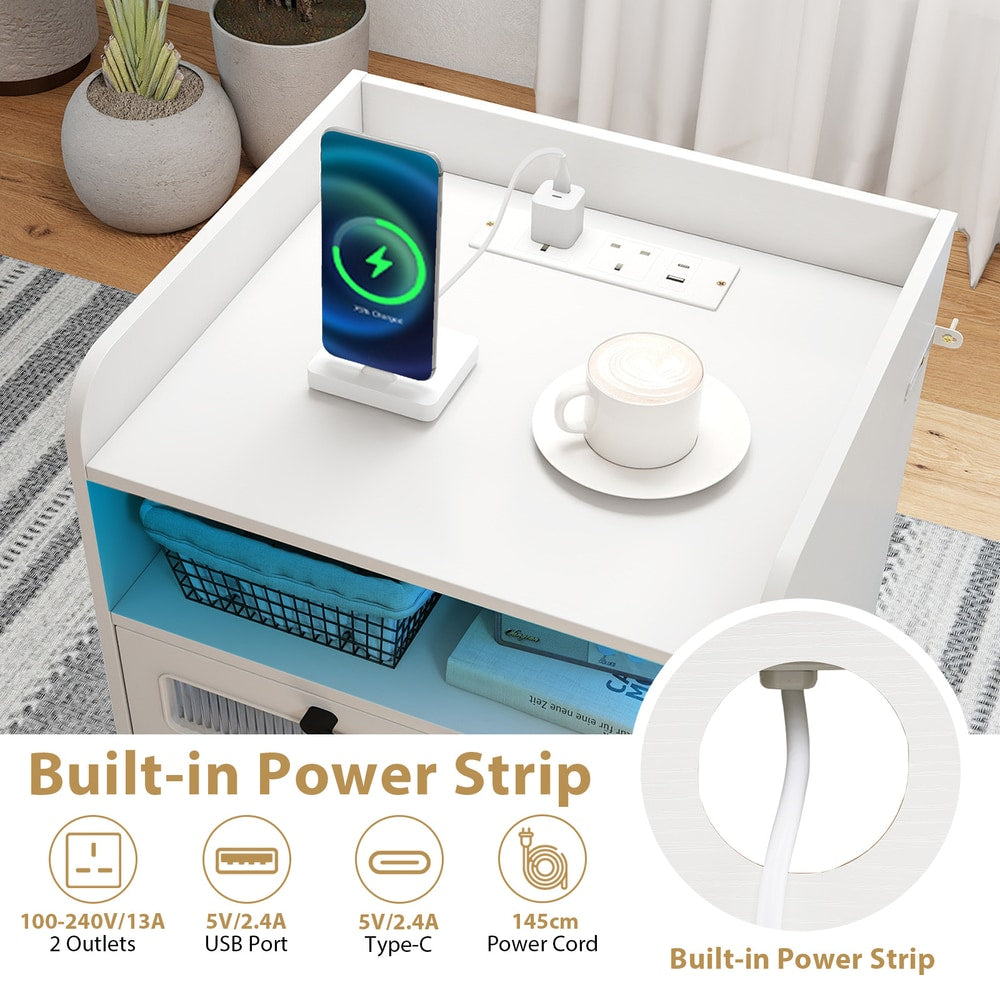 Close up of the built-in power strip on the white bedside table with USB ports