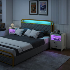 The nightstands placed on either side of a modern bed in a dimly lit bedroom setting