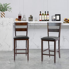 Two upholstered bar stools in a kitchen setting with a marble countertop