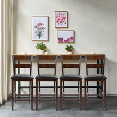 Four upholstered bar stools lined up against a wall with artwork above