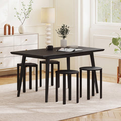 The bar stools placed around a dining table in a bright modern room