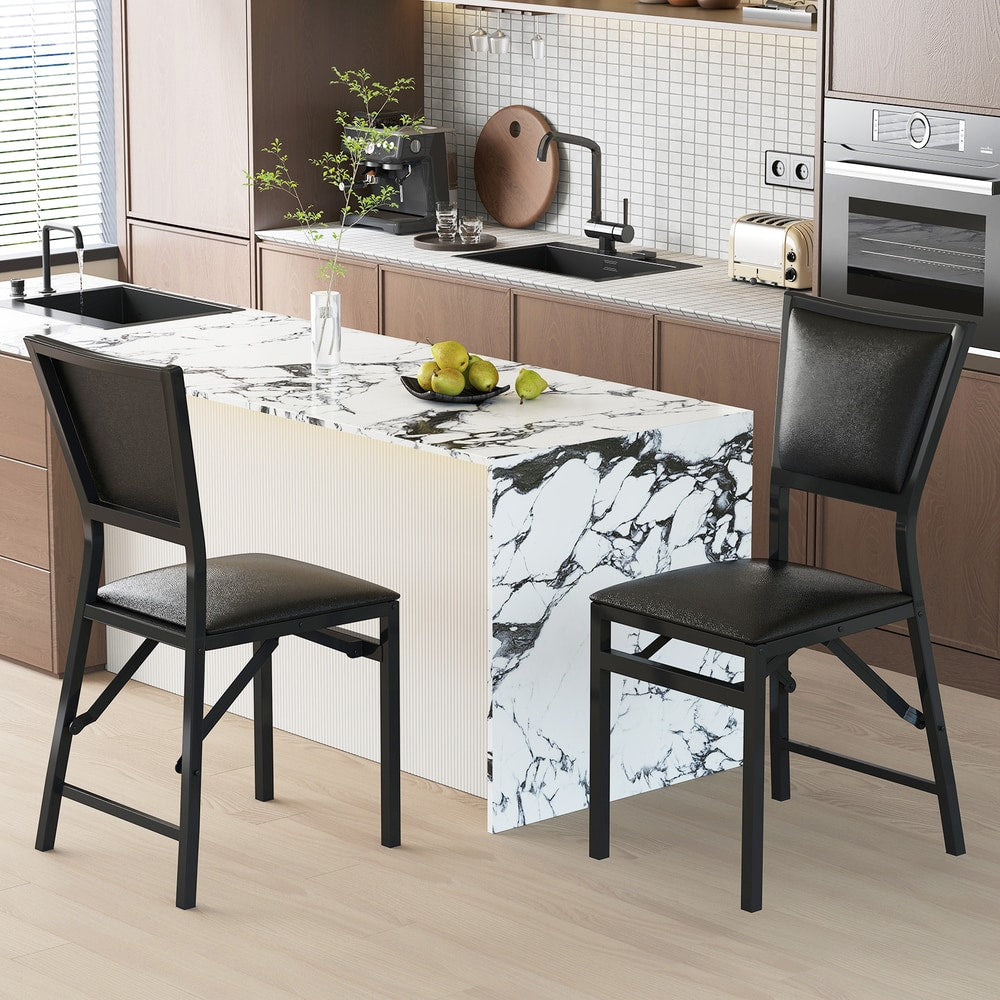 Four steel folding chairs in a modern kitchen setting