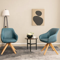 Two blue swivel accent chairs in a modern living room setting