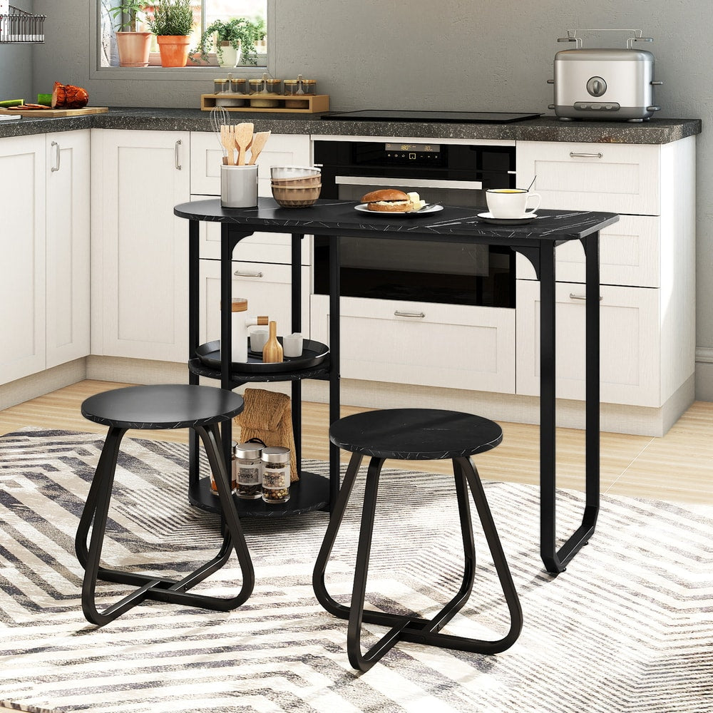 Black marble effect dining room set with two stools in a kitchen setting