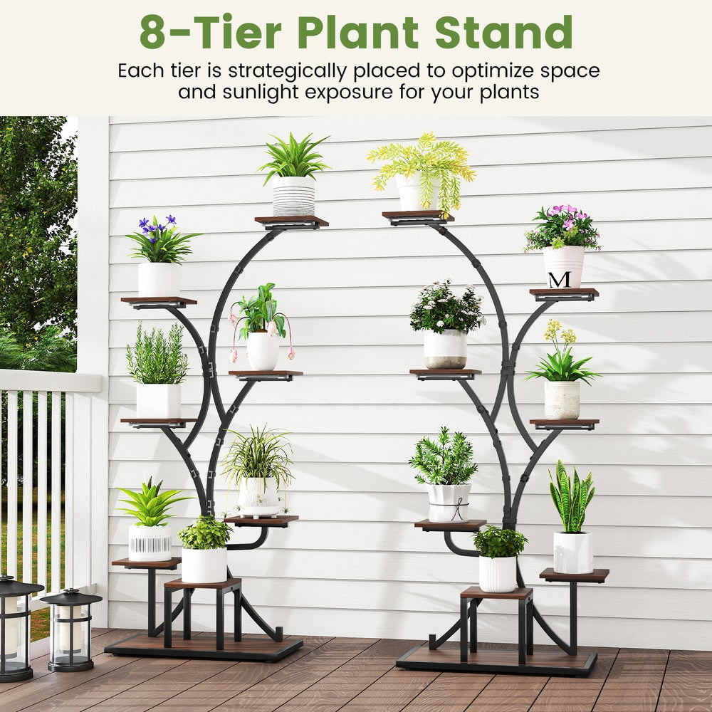 Two brown metal plant stands with plants on a patio or deck