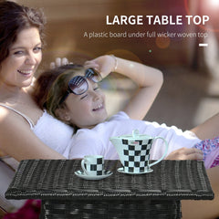 a close up of the black woven table top with a plastic board underneath