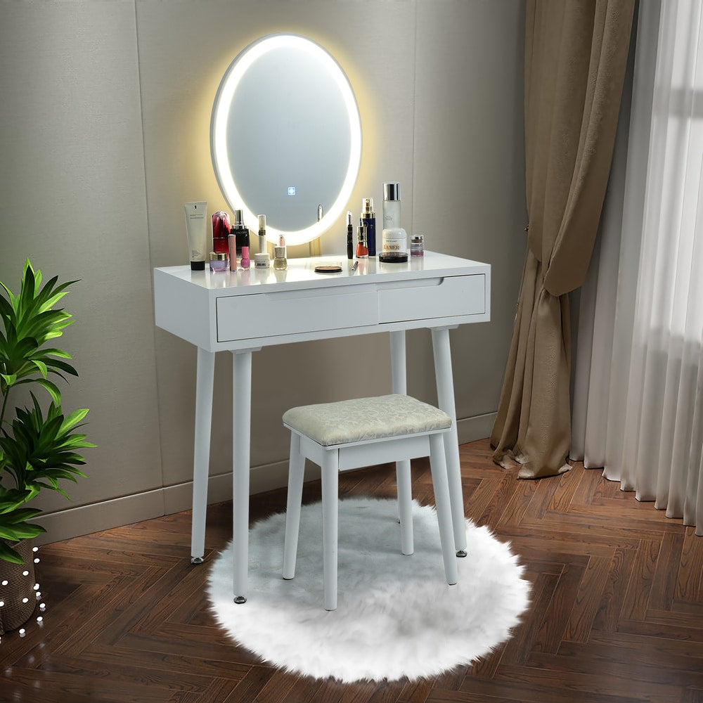 White makeup vanity with LED mirror and stool, set up with cosmetics in a room