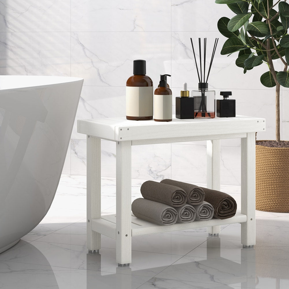 The shower stool placed in a modern bathroom next to a white bathtub with toiletries and towels