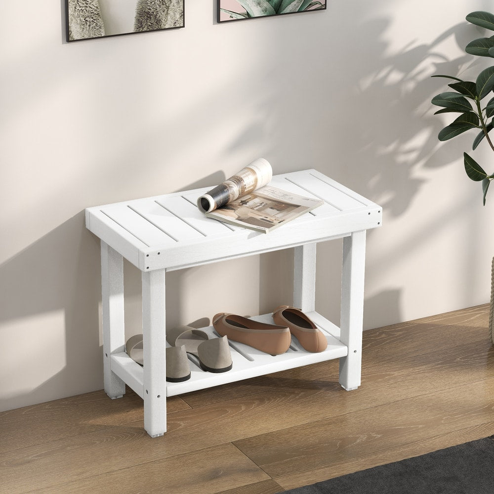 The shower stool used as a hallway shoe rack with a magazine resting on the slatted top surface