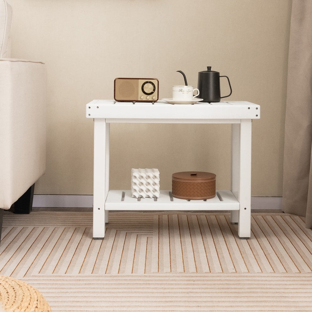 The shower stool styled as a small side table in a living room with a radio and tea set