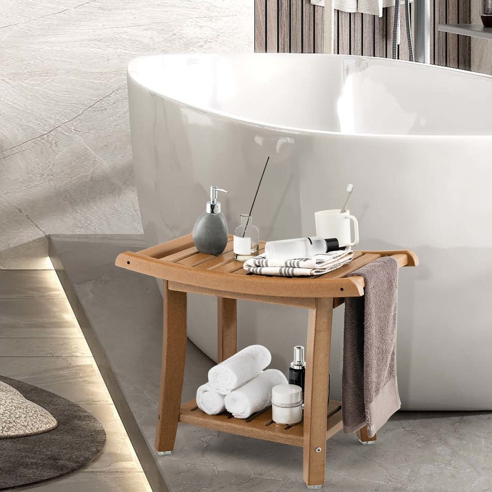 The brown shower bench with curved seat placed next to a bathtub