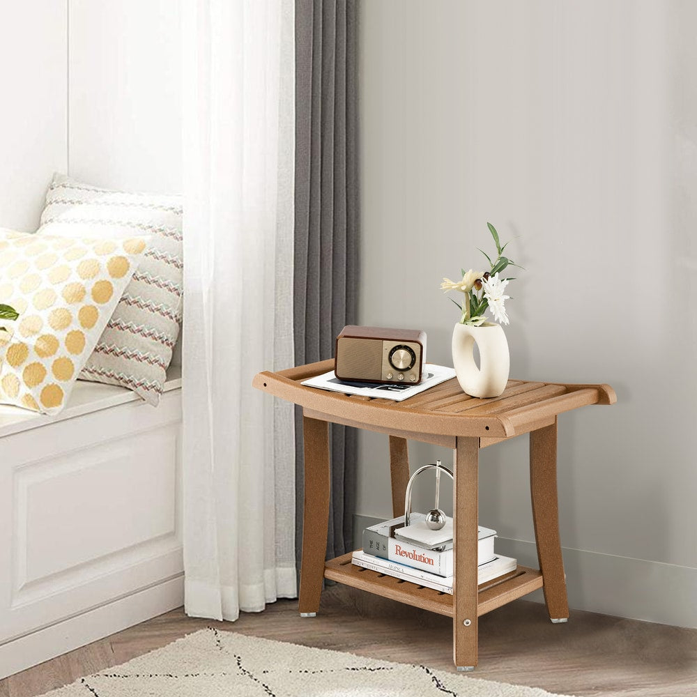 The two-tier shower bench with curved seat in a bright room with cushions and books