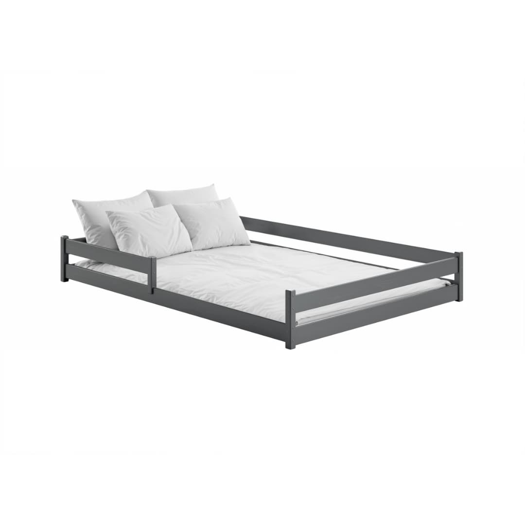 The dark grey wooden bed frame with white bedding and pillows