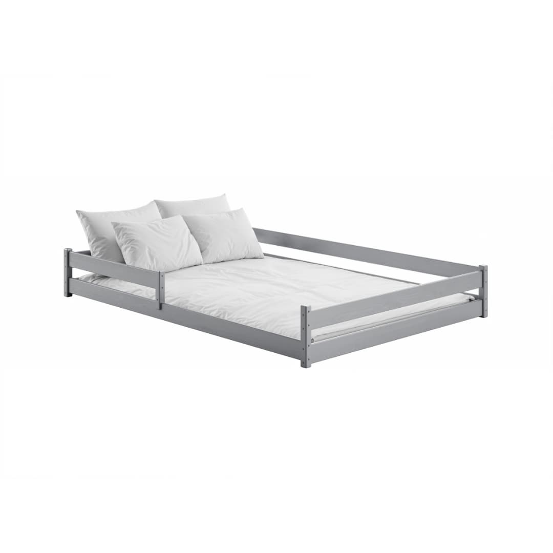 The light grey wooden bed frame with white bedding and pillows